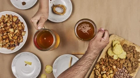 Drinking beer. Table full of beer snacks Stock Footage 132523594