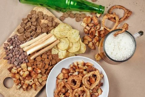 Drinking beer. Table full of beer snacks Stock Photos