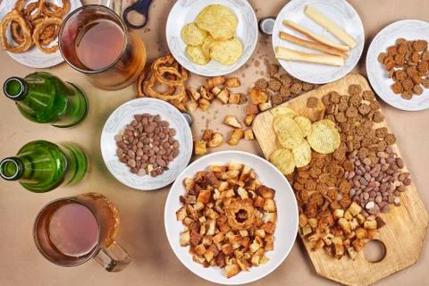 Drinking beer. Table full of beer snacks Stock Photos