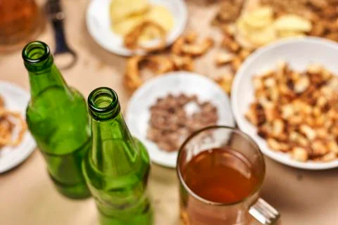 Drinking beer. Table full of beer snacks Stock Photos