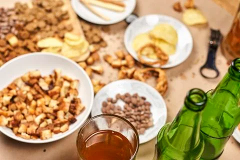 Drinking beer. Table full of beer snacks Stock Photos