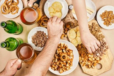 Drinking beer. Table full of beer snacks Stock Photos