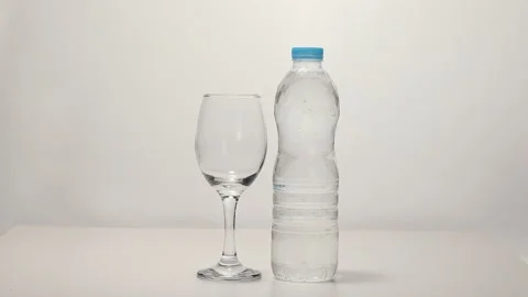 Drinking bottles and glasses placed on a turntable Stock Footage 249973483