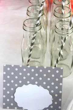 Drinking bottles with straws Stock Photos