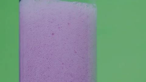Drinking a carbonated drink in a clear flask, Stock Footage 237756516