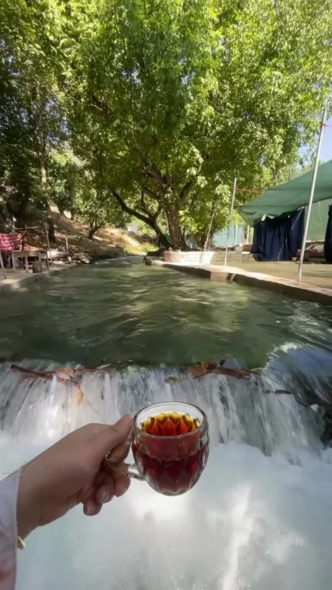 Drinking Chai By Rushing River Stream 库存影片 340871918