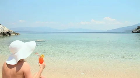Drinking cocktail on the beach Stock Footage