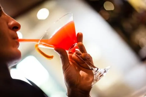 Drinking cocktail Stock Photos