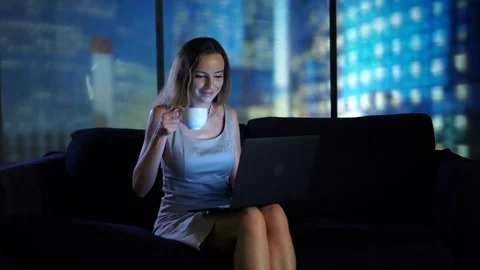 Drinking coffe tea in the office. Working at night, odern high tech office Stock Footage 95096243