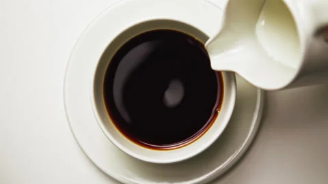 Drinking Coffee Beverage with White Milk from Espresso Cup at Morning Breakfast Stock Footage 238728330