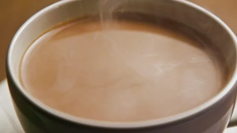 Drinking Coffee Beverage with White Milk from Espresso Cup at Morning Breakfast Stock Footage 255256633