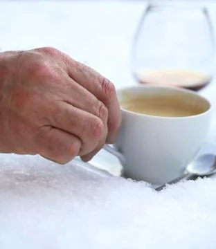 Drinking coffee with brandy in the snow Stock Photos