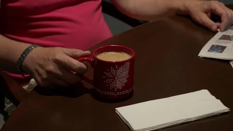 Drinking coffee, close up on the cup. 動画素材 77809507