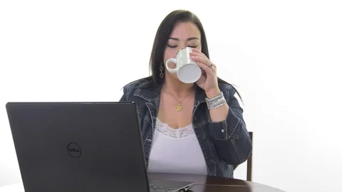 Drinking coffee at computer- Stock Footage 86534638