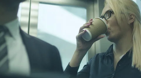 Drinking Coffee in Elevator Stock Footage 39972950