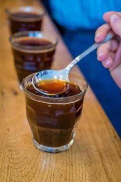 Drinking coffee by the spoon Stock-Fotos