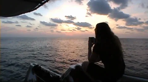 Drinking coffee at sundown Stock Footage 22571575