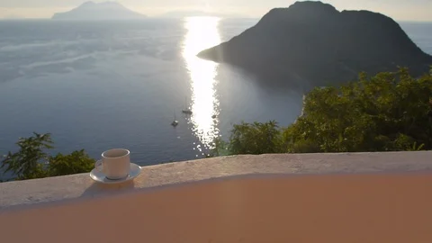 Drinking coffee with a view from island in Mediterranean sea, Sicily, Italy Stock Footage 130143093