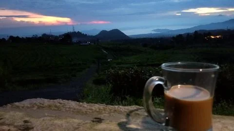 Drinking coffee while waiting for the sunrise Stock Photos