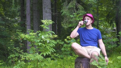 Drinking coffee in the woods Stock Footage 119606442