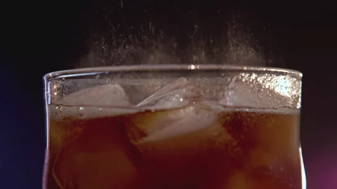 Drinking Coke Beverage or Cold Bubbly Liquid Filling Glass Cup with Ice Cubes Stock Footage 236372531