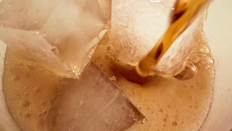 Drinking Coke Beverage or Cold Bubbly Liquid Filling Glass Cup with Ice Cubes Stock Footage 236372577