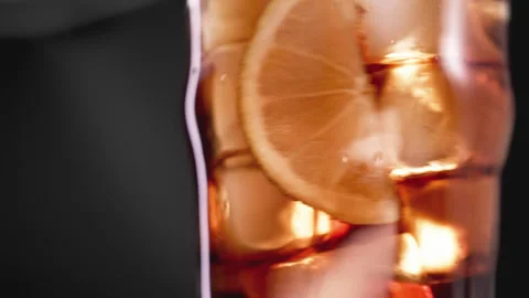 Drinking Coke Beverage or Cold Bubbly Liquid Filling Glass Cup with Ice Cubes Stock Footage 264798998