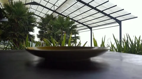 Drinking a cup of coffee in a yellow cup outdoors Stock Footage 251327210