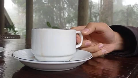 Drinking a cup of hot lemon tea in the white cup Stock Footage 150215703