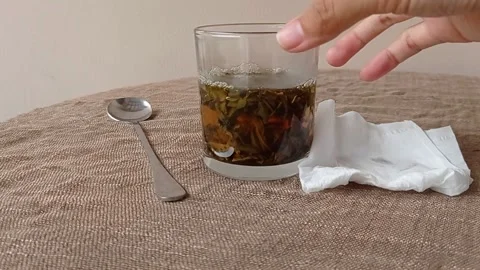 Drinking a cup of tea on a brown table Stock Footage 145623935