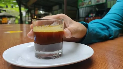 Drinking espresso coffee at an outdoor table Stock Footage 156517183