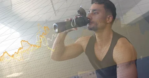 Drinking fit man in dark tank top sipping reusable bottle on bench after set, 库存影片 331002266