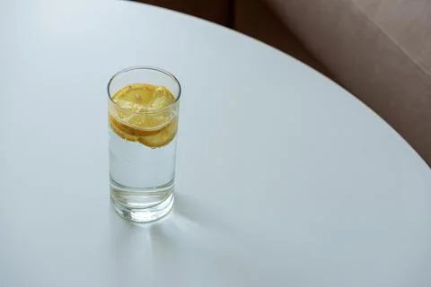 Drinking fresh lemon water for detox and wellness Stock Photos