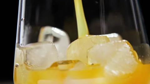 Drinking Fruit Beverage or Cold Juice of Glass Cup with Ice Cubes as Fresh Food Stock Footage 236371463