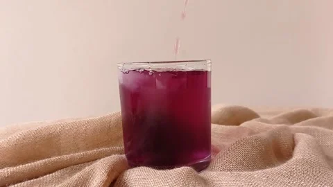 Drinking a glass of cold cola with a straw Stock Footage 146253857