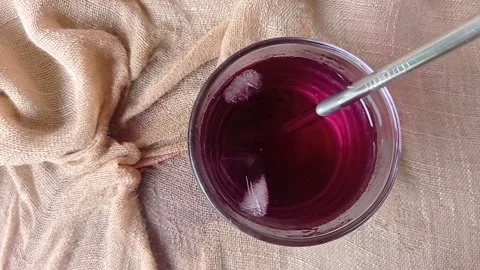 Drinking a glass of cold cola with a straw Stock Footage 146253952