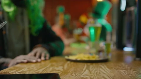 Drinking Glass of Wine or Stout Ale at Bar Counter on St Patricks Day Stock Footage 261512093