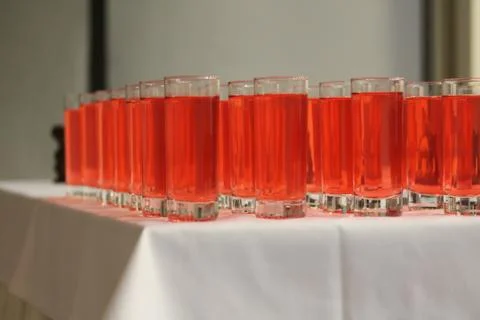 Drinking glasses with red drinks at the party Stock Photos