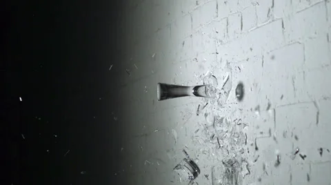 Drinking glasses shattering on the wall, Slow Motion Stock Footage 31819396