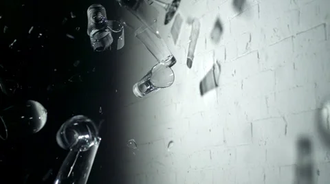 Drinking glasses shattering on the wall, Slow Motion Stock Footage 31819432