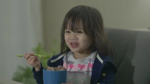 Drinking Hot Chocolate with Spoon Cute Asian Girl Baby Toddler Video stock 102961543