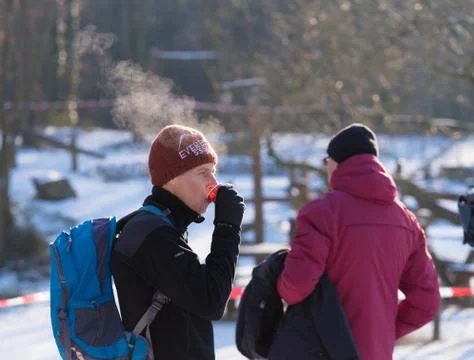 Drinking hot coffee in winter Foto stock