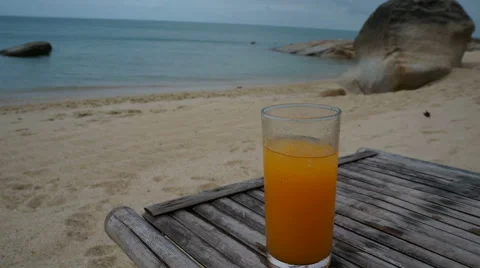 Drinking Juice on the beach, emptying glasses, stop motion Stock Footage 43173884