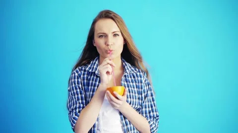 Drinking orange juice Stock Footage 21482553