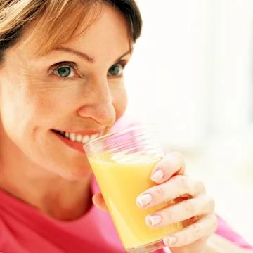 Drinking orange juice Foto stock
