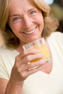 Drinking orange juice 스톡 사진