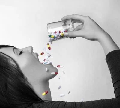 Drinking pills Stock Photos