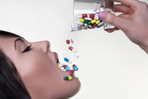 Drinking pills Foto stock
