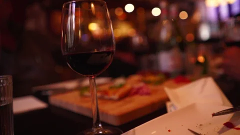 Drinking Red Wine from Table Shallow Depth of Field Stock Footage 92080414