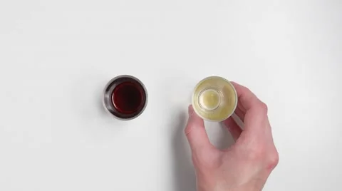 Drinking schnapps after taking a glass out of the frame. Stock Footage 46748789